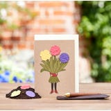 Cart&atilde;o de felicita&ccedil;&otilde;es florescente "Menina das Flores"